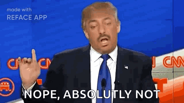 a man in a suit and tie is making a funny face while talking into a microphone .