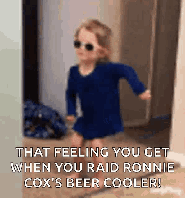 a little girl wearing sunglasses and a blue shirt is running in a hallway .
