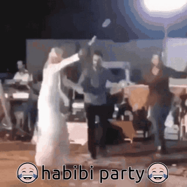 a group of people are dancing in front of a sign that says " habibi party "