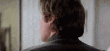 a close up of a man 's back in a black jacket .