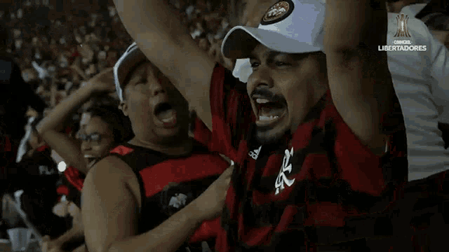 a man wearing a hat with the year 2017 on it is cheering