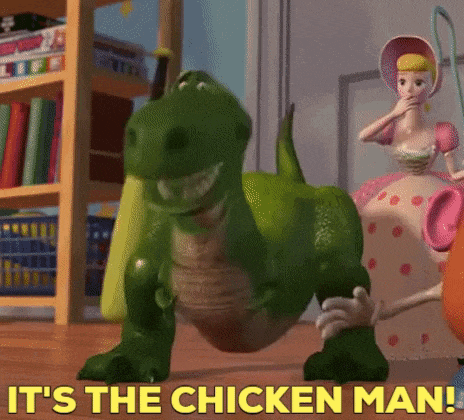 rex from toy story is standing on a wooden floor next to a toy doll .