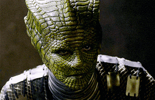 a close up of a person 's face with a crocodile skin covering