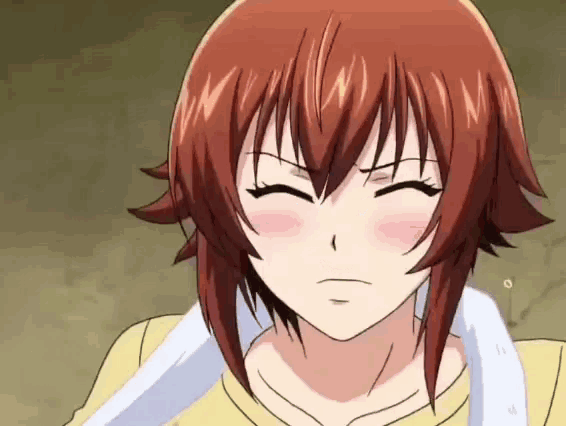 a girl with red hair and a towel around her neck is making a funny face .