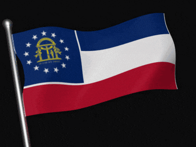 a georgia flag is waving in the wind on a black background