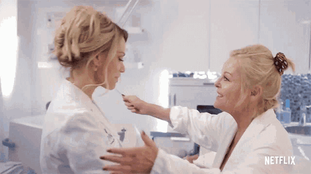 a netflix ad shows two women in white coats talking to each other