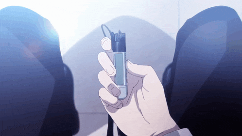 a person holding a lighter in their hand