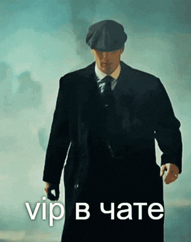 a man in a suit and hat is walking with the words vip in a foreign language