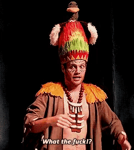 a man in a native american costume is saying what the fuck