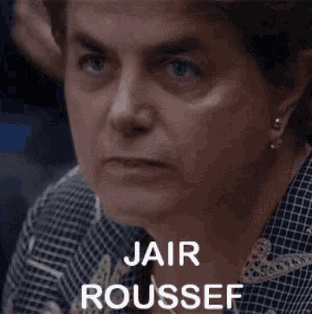 a close up of a woman 's face with jair roussef written below her