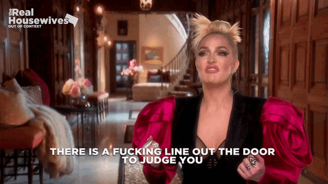 a woman in a red dress says there is a line out the door to judge you