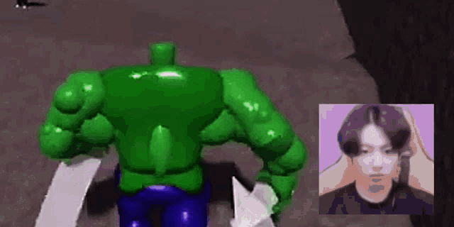 a hulk is standing next to a man in a video game .