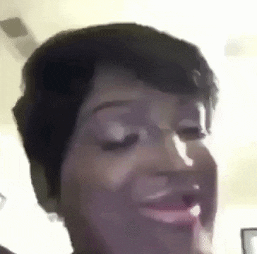 a close up of a woman 's face with a funny face .