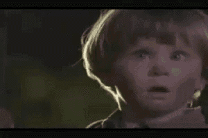 a close up of a child 's face with yep written in white letters
