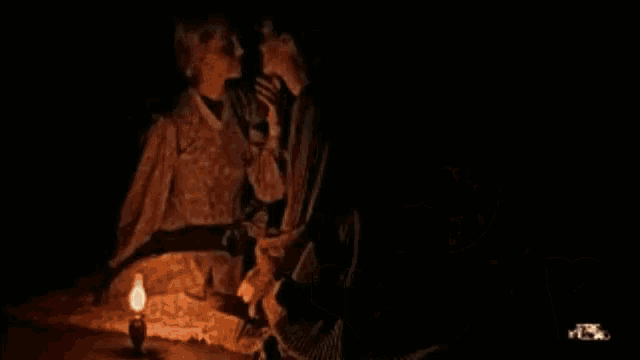 a poster for come dickinson shows a man and woman kissing