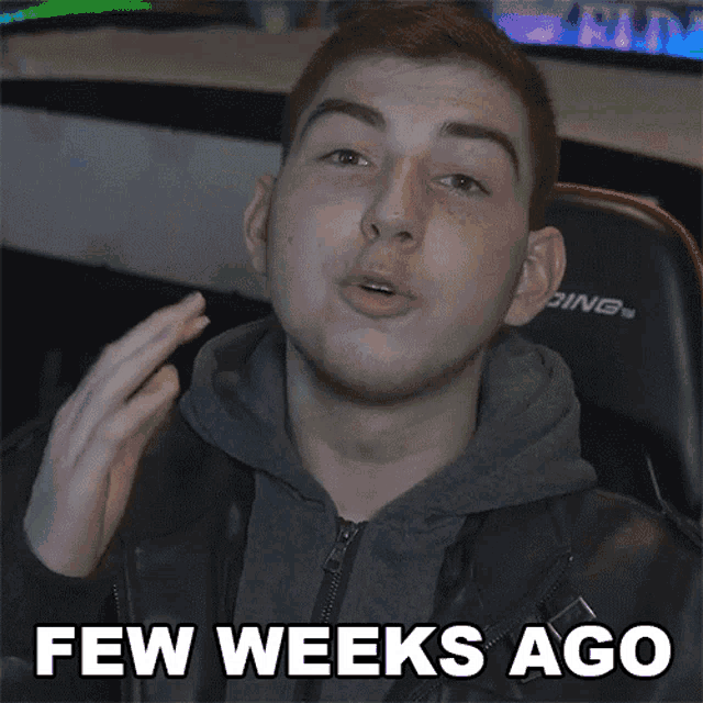 a young man is making a funny face with the words few weeks ago behind him .