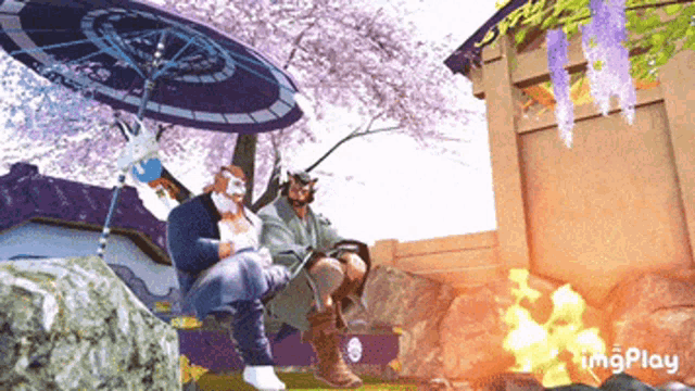a couple of people sitting under an umbrella with a fire in the background and the word imgplay on the bottom