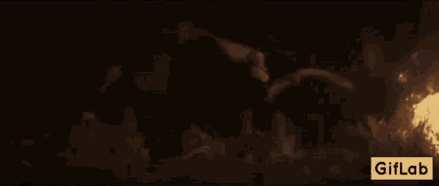 a dragon is flying over a group of people in a field .