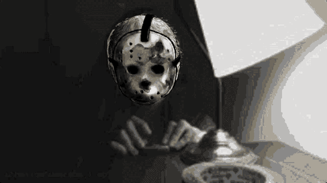 a black and white drawing of jason voorhees ' mask