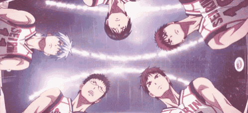 a group of basketball players are standing in a circle and one of them has the number 4 on his jersey
