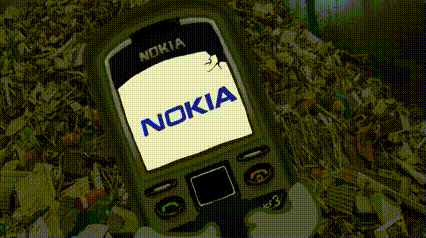 a nokia cell phone is sitting on a pile of shredded paper