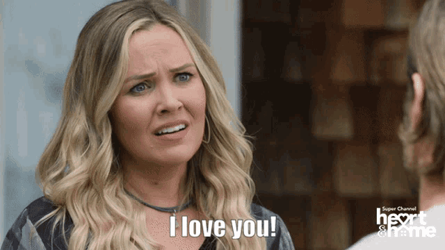 a woman says " i love you " in front of a super channel logo
