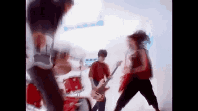 a blurry picture of a group of people playing instruments in a band .