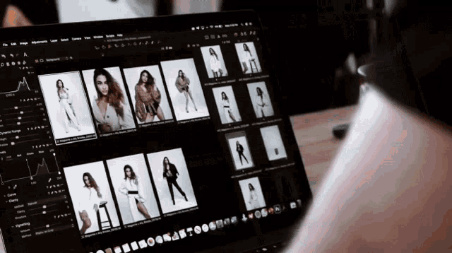 a person is looking at a computer screen with a lot of photos on it