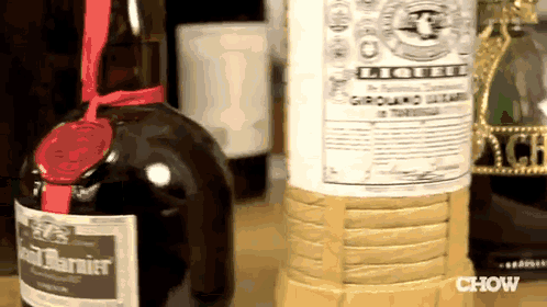 a bottle of liqueur sits next to a bottle of ground beef