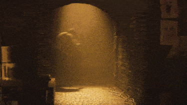 a man in a mask is standing in a cave