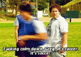 two men are standing in a field and one of them says " fucking calm down greg it 's soccer "