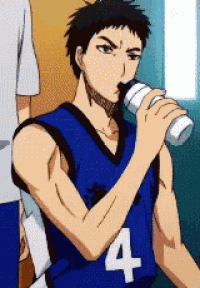 a basketball player wearing a blue jersey with the number 4 drinking from a bottle