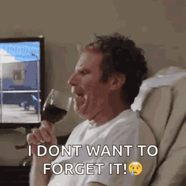 a man is sitting in a hospital bed drinking a glass of wine and saying i dont want to forget it .