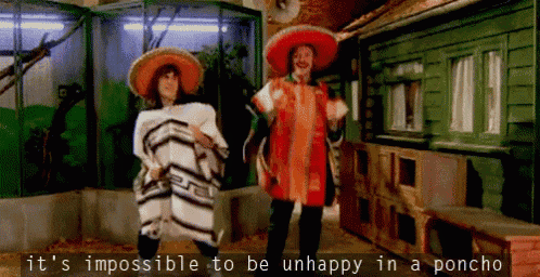 a man and woman are dancing in a poncho with the words " it 's impossible to be unhappy in a poncho " below