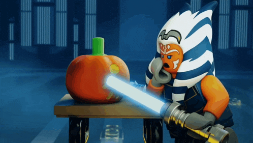 a lego star wars character is holding a light saber in front of a pumpkin on a table