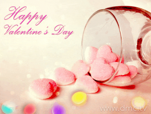 a happy valentine 's day greeting card with a glass filled with pink hearts