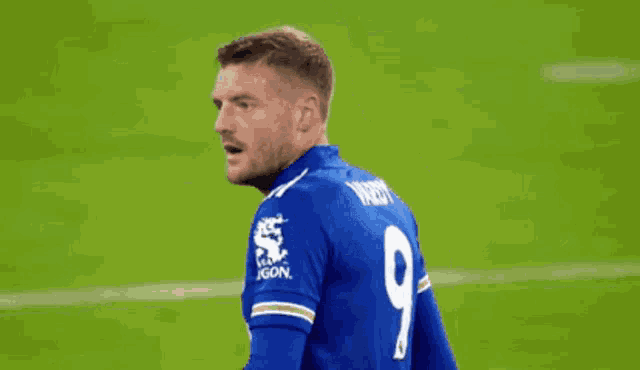 a soccer player wearing a blue jersey with the number 9