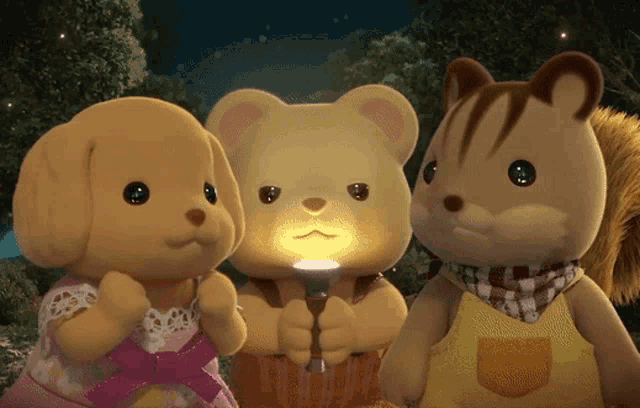 three stuffed animals including a teddy bear and a squirrel holding a flashlight