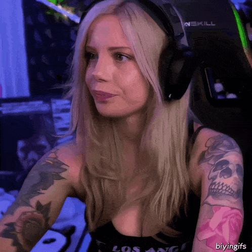a woman wearing headphones and a shirt that says los angeles on it