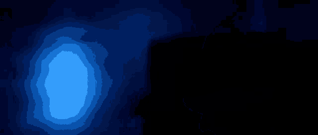 a person is holding a sword in a dark room with smoke coming out of it .