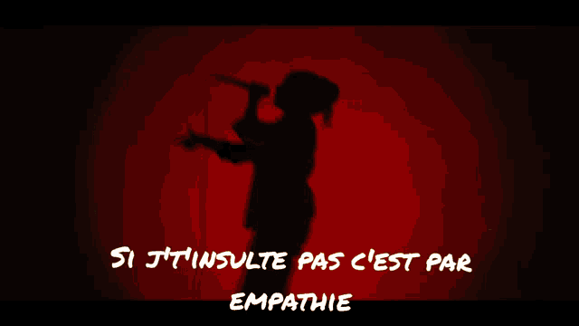a man singing into a microphone with the words si j't'insulte pas c'est par empathie written below him
