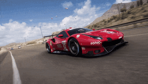 a red racing car with sonic written on the side