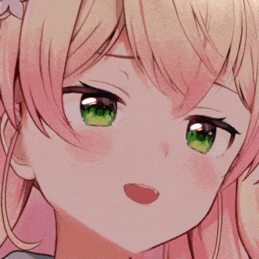 a close up of the face of a girl with pink hair and green eyes