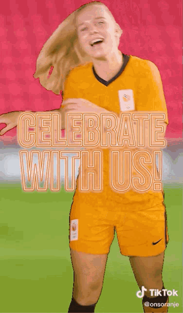 a woman in a soccer uniform with the words " celebrate with us " behind her
