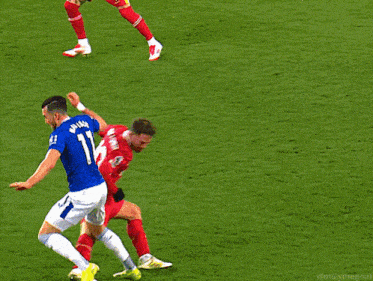 a soccer player wearing a red jersey with the number 8 on it