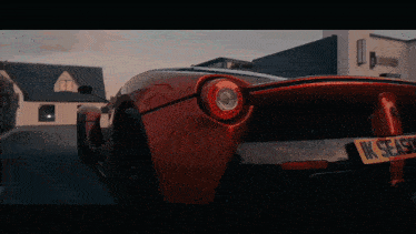 a red sports car with the license plate ik season