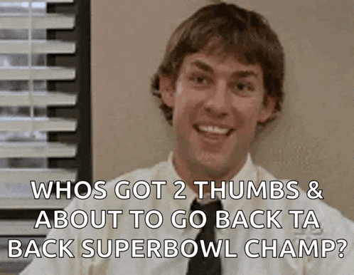 a man in a white shirt and black tie is smiling with the words whos got 2 thumbs & about to go back ta back superbowl champ