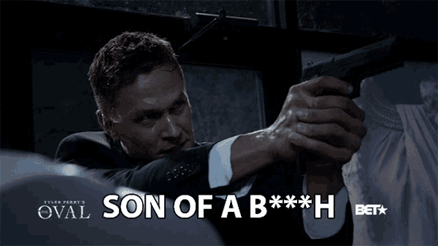 a man holding a gun with the words son of a b *** h