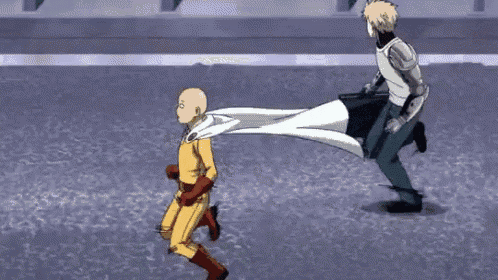 a man in a knight 's armor is standing next to a bald man in a yellow suit and cape .