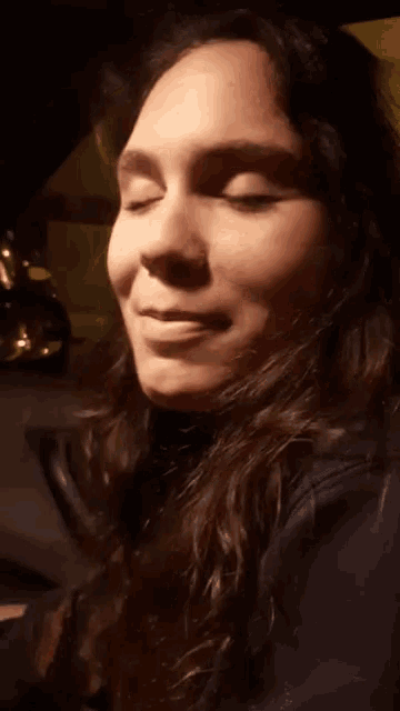 a close up of a woman making a funny face